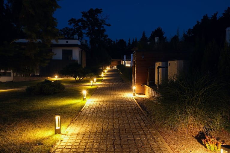 Alley stone path in a country residence illuminated by street lamps